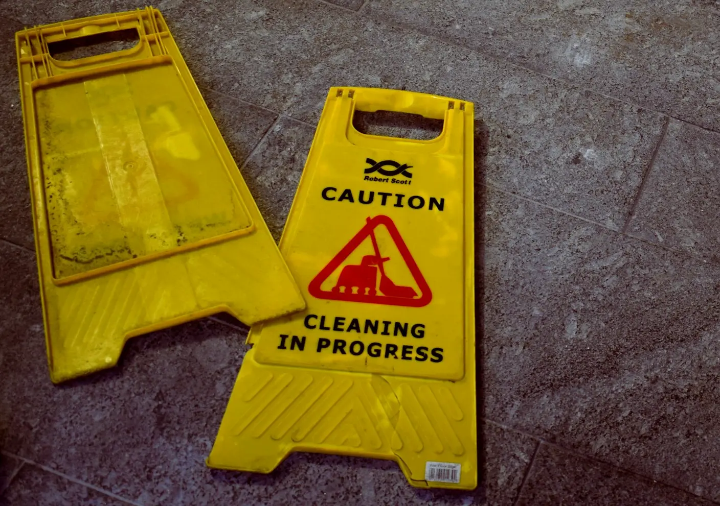 two Caution signages